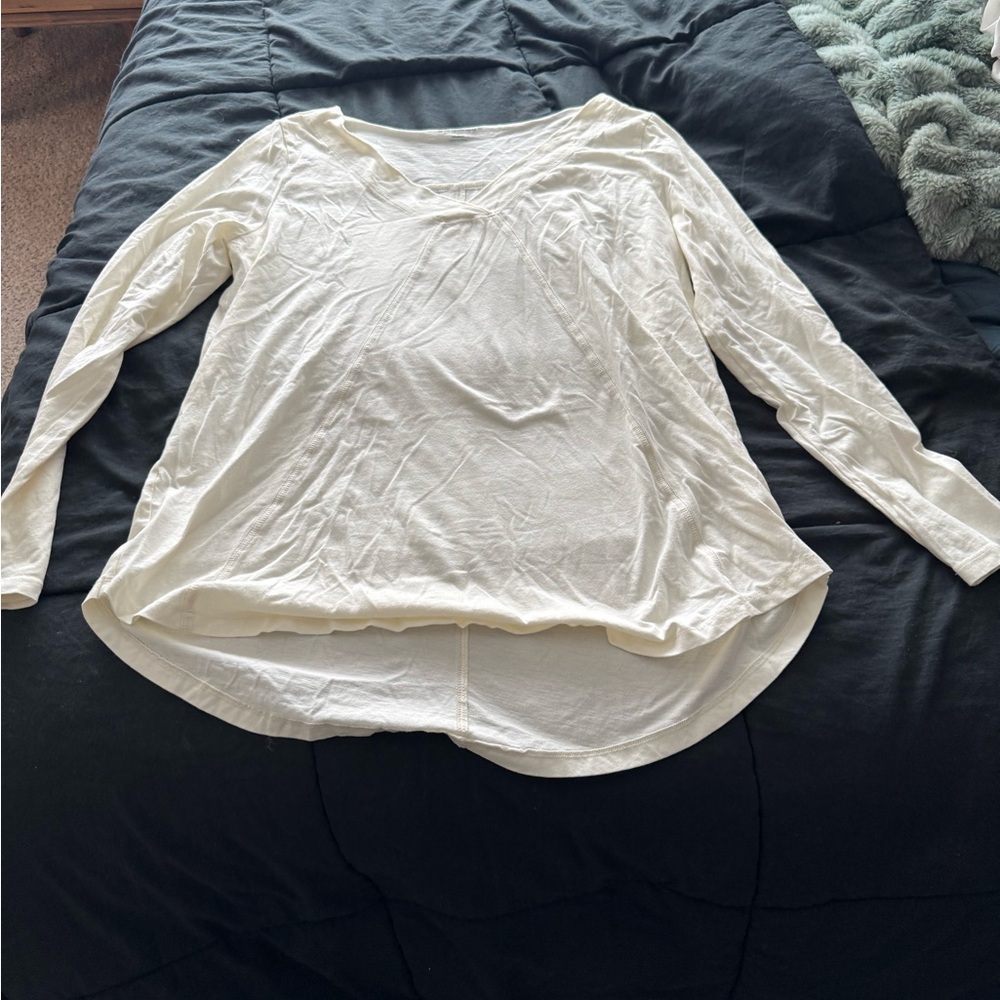 Two white soft surroundings t shirts.